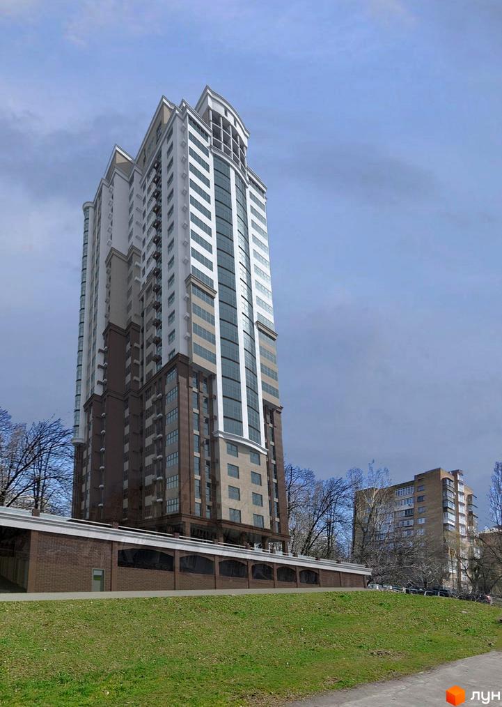 Високоповерховий житловий комплекс на вулиці Іоанна Павла ІІ, 11. Будинок має білий та коричневий фасади з великими вікнами. Навколо зелена галявина та дерева.