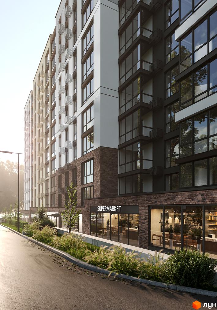 Зображення фасаду Житлового комплексу Park Town з великими вікнами та магазином на першому поверсі. Навколо будинку зелені насадження.