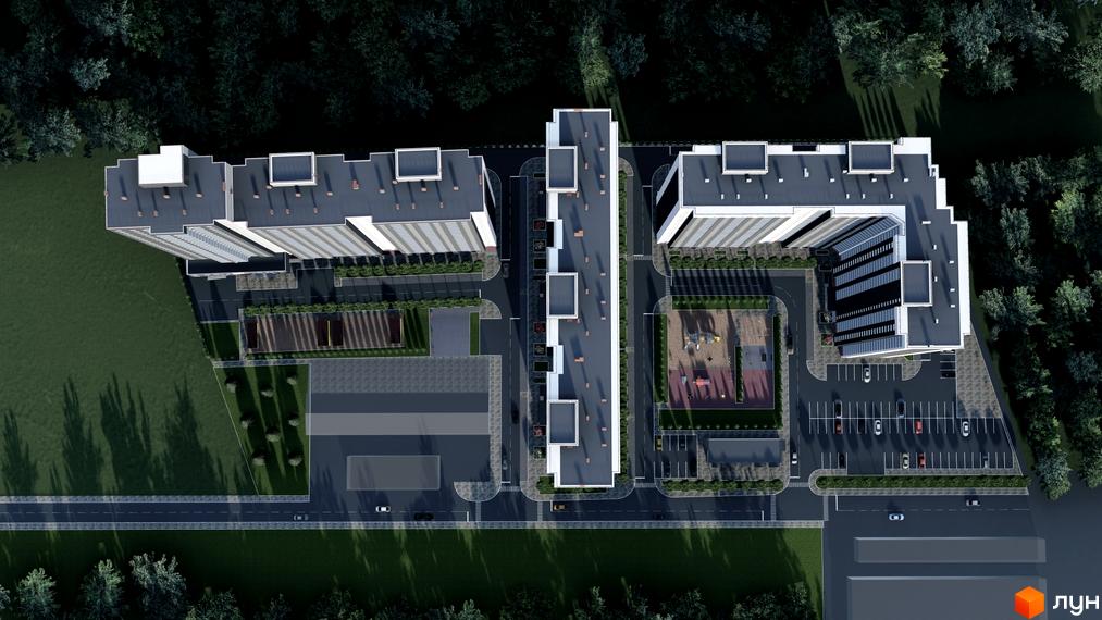 Вид зверху на житловий комплекс Деснянський з високими будинками та прибудинковою територією з дитячим майданчиком та парковкою.