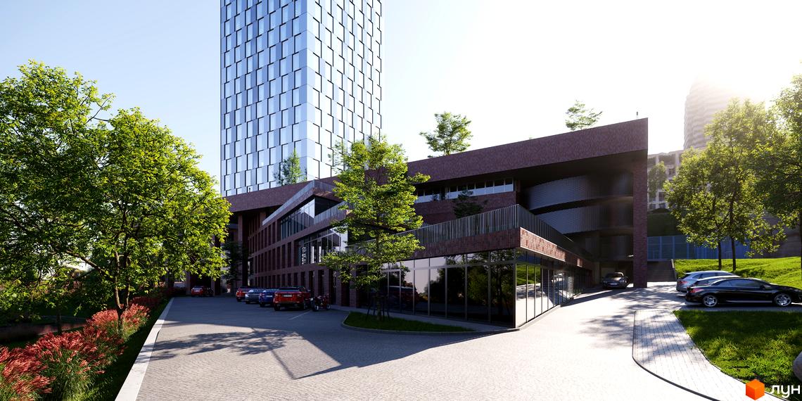 Зображення фасаду будівлі БФК MAYAK з великими вікнами та терасами, поряд з якою розташована парковка та зелені насадження.