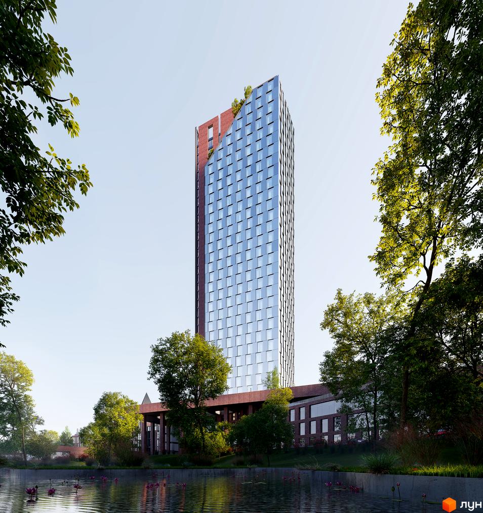 БФК MAYAK – висотна новобудова зі скляним фасадом та цегляними елементами, розташована біля водойми з квітами та зеленими деревами.