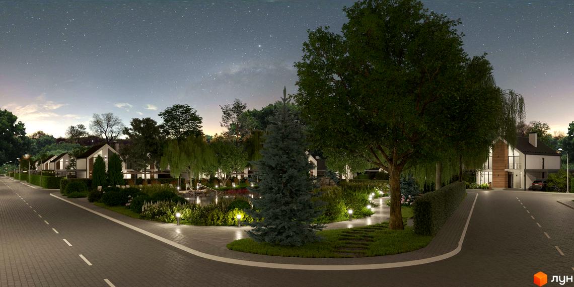 Нічний пейзаж котеджного містечка Gardd House Eco Village з двоповерховими будинками світлих тонів, освітленими доріжками та водоймою серед зелені.