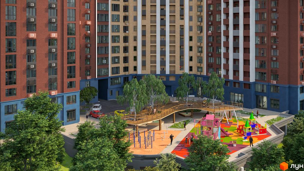 Житловий комплекс Лук'янівський каскад. Висотна будівля з цегляною кладкою та великими вікнами. На території дитячий майданчик та зелені насадження.
