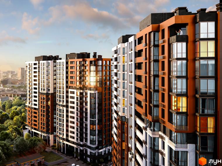 Зображення Житлового комплексу CITY HUB з багатоповерховими будинками різного кольору. Навколо видно дерева та міську забудову.