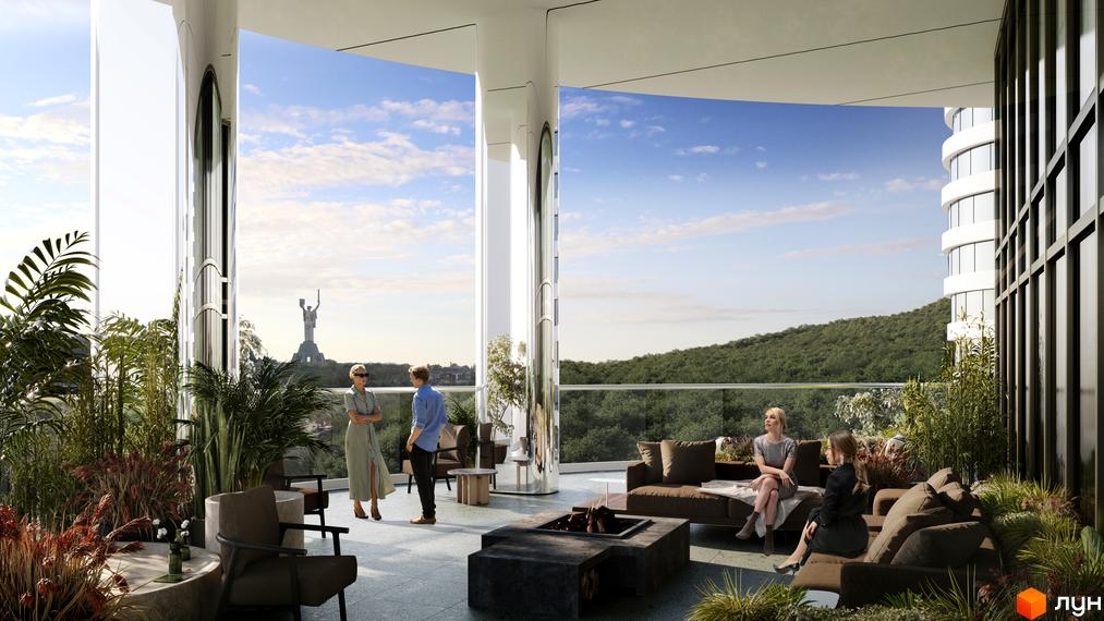 Вид на терасу житлового комплексу INTERGAL CITY. На терасі розташовані зони відпочинку з м'якими диванами та столиками. З тераси відкривається вид на місто.