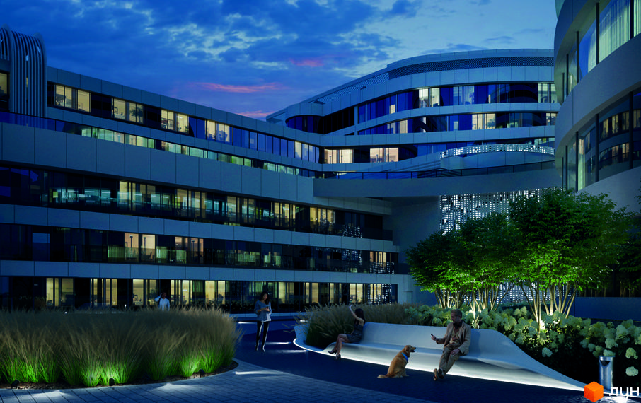 INTERGAL CITY - це багатоповерховий будинок з великими вікнами та світлим фасадом. На прибудинковій території розташовані лави, зелені насадження та освітлення.