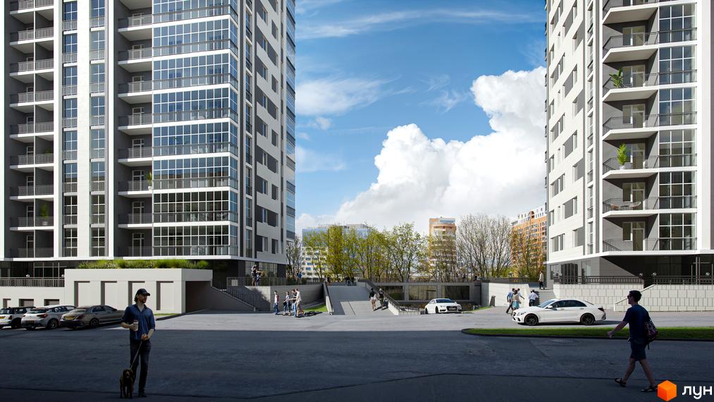 Зображення фасаду та прибудинкової території Житлового комплексу Ключ. Багатоповерховий будинок з великими вікнами та балконами, поруч парковка та пішохідна зона.