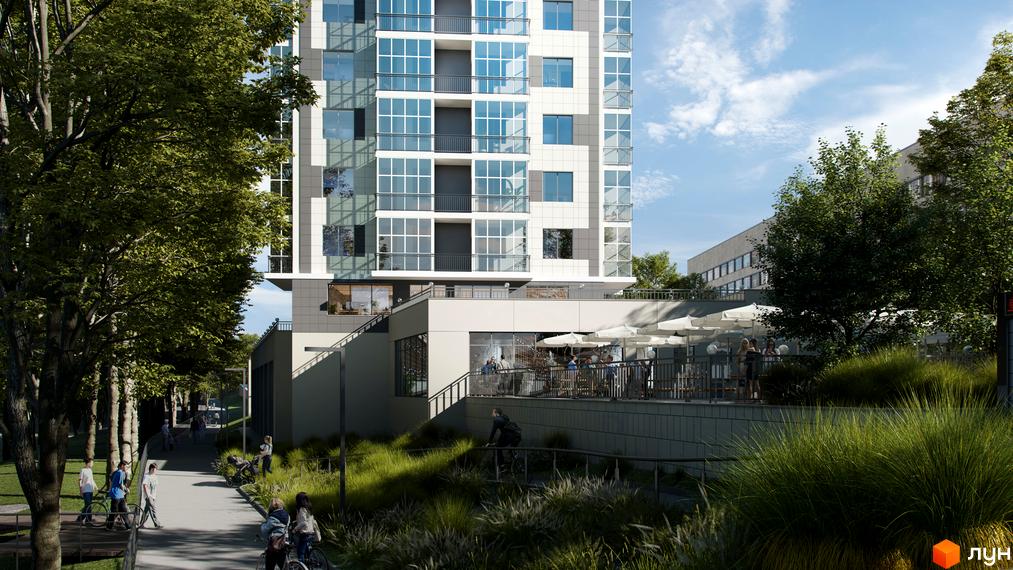 Зображення фасаду та прибудинкової території Житлового комплексу Ключ. Вигляд багатоповерхового будинку з великими вікнами та зеленими насадженнями.