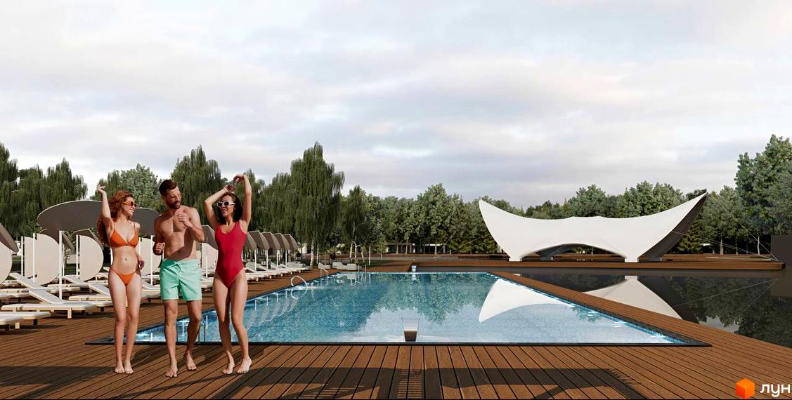 Котеджне містечко Lakeville: люди відпочивають біля басейну на дерев'яній терасі, на задньому плані видно тентову конструкцію та дерева.