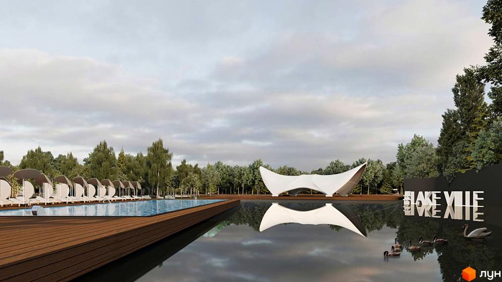 Котеджне містечко Lakeville з басейном, шезлонгами та водоймою з лебедями. Сучасна архітектура комплексу на тлі зелених дерев.