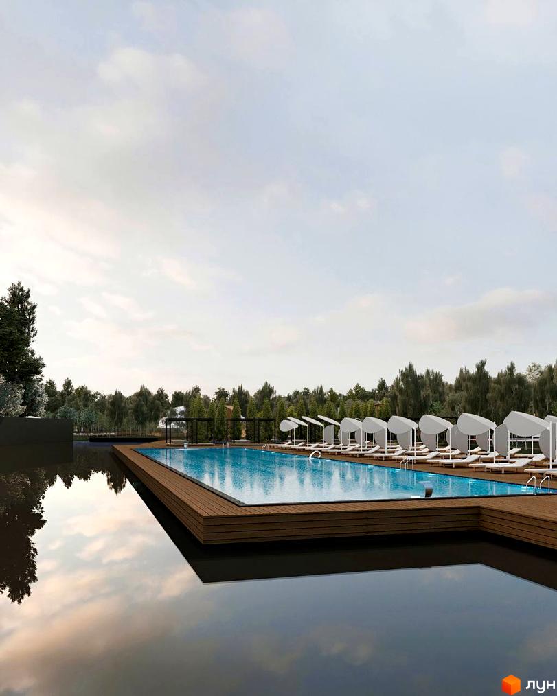 Котеджне містечко Lakeville з басейном та шезлонгами. Навколо комплексу розташовані дерева та хмарне небо.