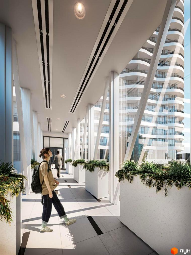 Unity Towers: Вид з просторого холу на висотний житловий комплекс з вигнутими балконами. Інтер'єр має білі колони та зелені насадження.