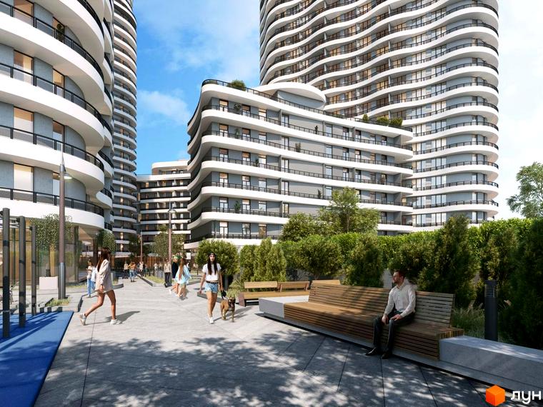 Житловий комплекс Unity Towers: високі будинки з білими хвилястими балконами, оточені доріжками, зеленими насадженнями та зонами відпочинку.