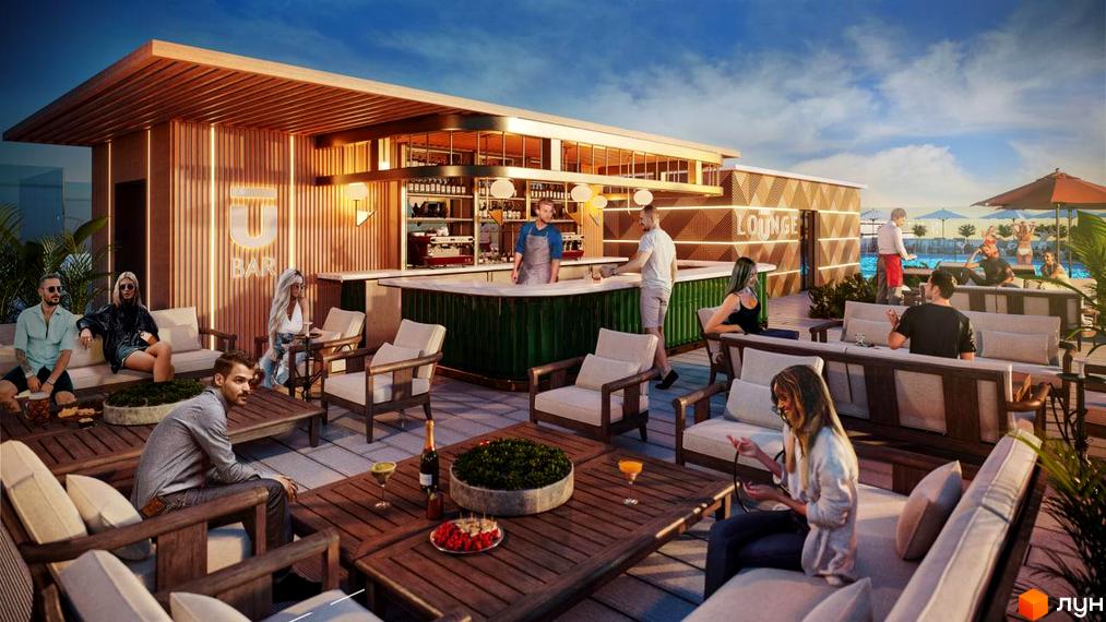 Тераса з баром та зоною відпочинку на даху Житлового комплексу Unity Towers. Видно людей, що відпочивають, та басейн на задньому плані.
