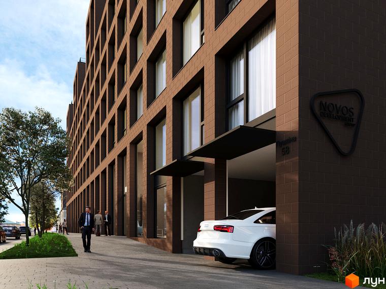 Зовнішній вигляд житлового комплексу AMSTERDAM з коричневої цегли, з великими вікнами та прибудинковою територією з деревами та автомобілем.