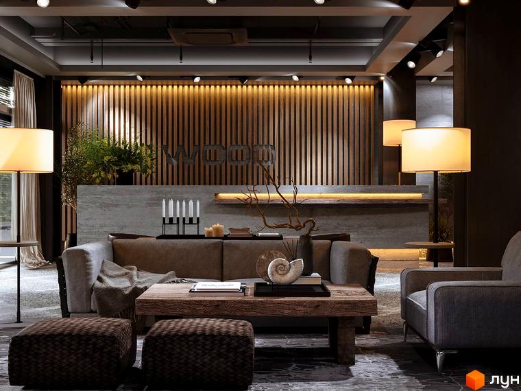 Інтер'єр вітальні апарт-комплексу Wood Apartments з диваном, кріслом та кавовим столиком. Сучасний дизайн та затишна атмосфера.