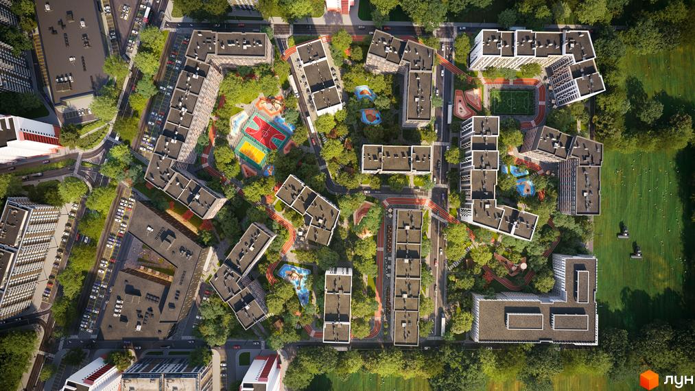 Вид зверху на житловий комплекс Євромісто 2 з сучасними будинками та доглянутою прибудинковою територією, що включає спортивні майданчики та зелені зони.