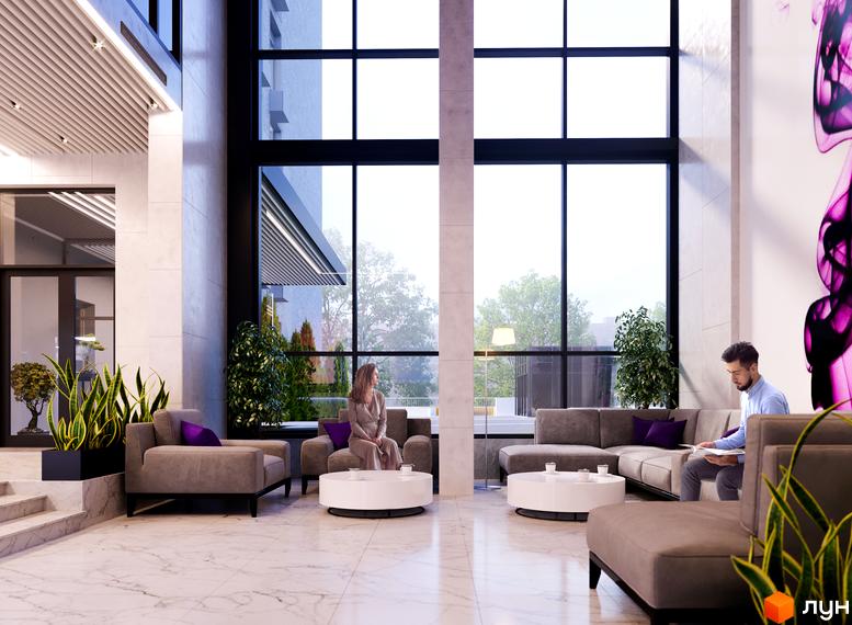 Просторий хол житлового комплексу ANRIL house з великими вікнами, зручними диванами та елегантним дизайном. Люди відпочивають у зоні очікування.