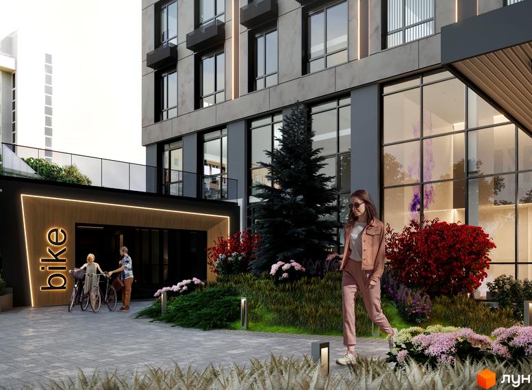 Фасад будівлі ЖК ANRIL house з великими вікнами та вхідною групою для велосипедів. На прибудинковій території рослини та доріжки з бруківки.