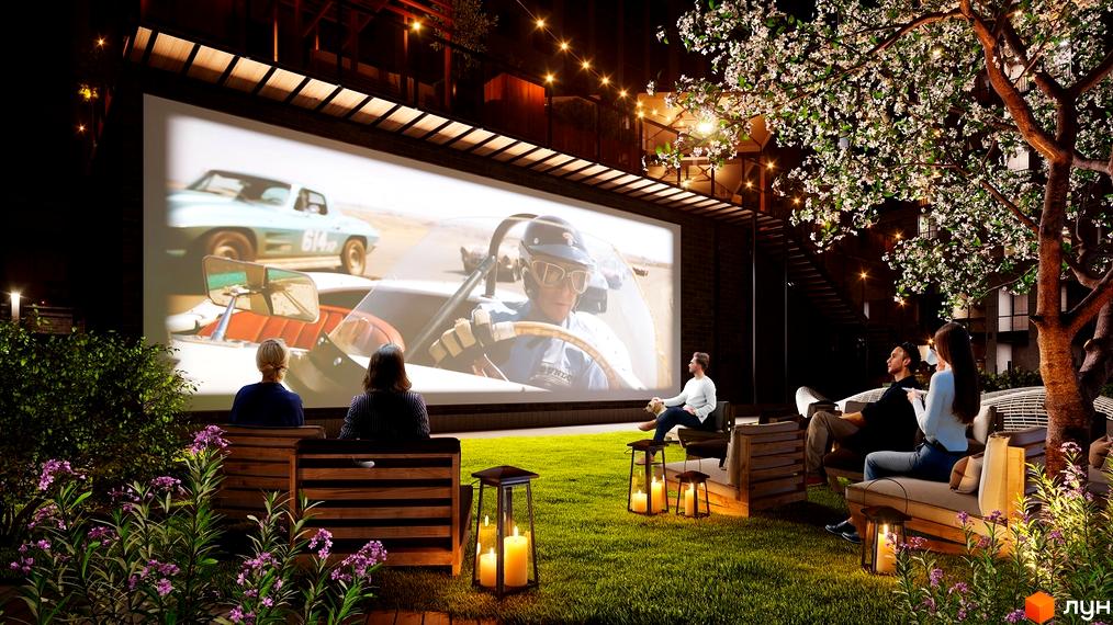 Житловий комплекс Stanford. Вечірній кіносеанс на відкритому повітрі. Зелена галявина, зручні дивани та ліхтарі створюють атмосферу затишку.