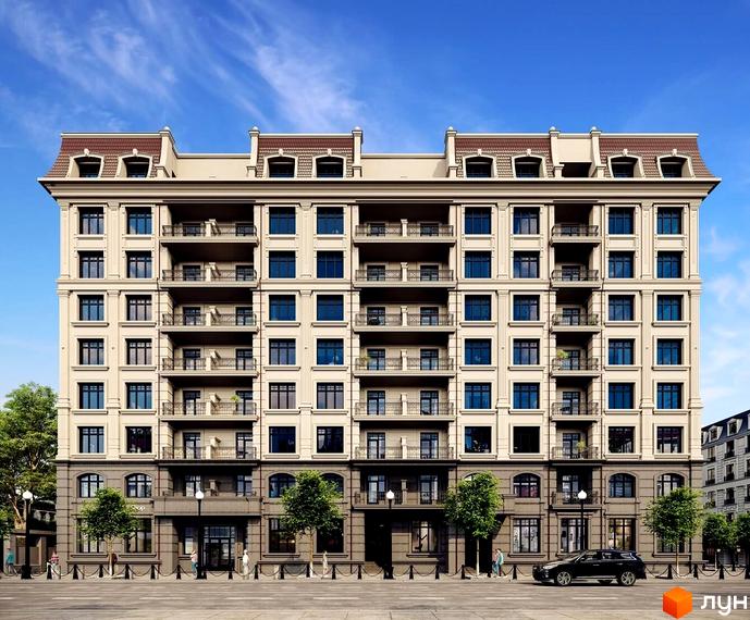 Клубний будинок LA MANCHE – це елегантна багатоповерхова будівля з балконами та мансардними вікнами під коричневим дахом. Фасад оздоблений колонами та симетричними вікнами. Перед будинком – тротуар, вулиця та дерева.