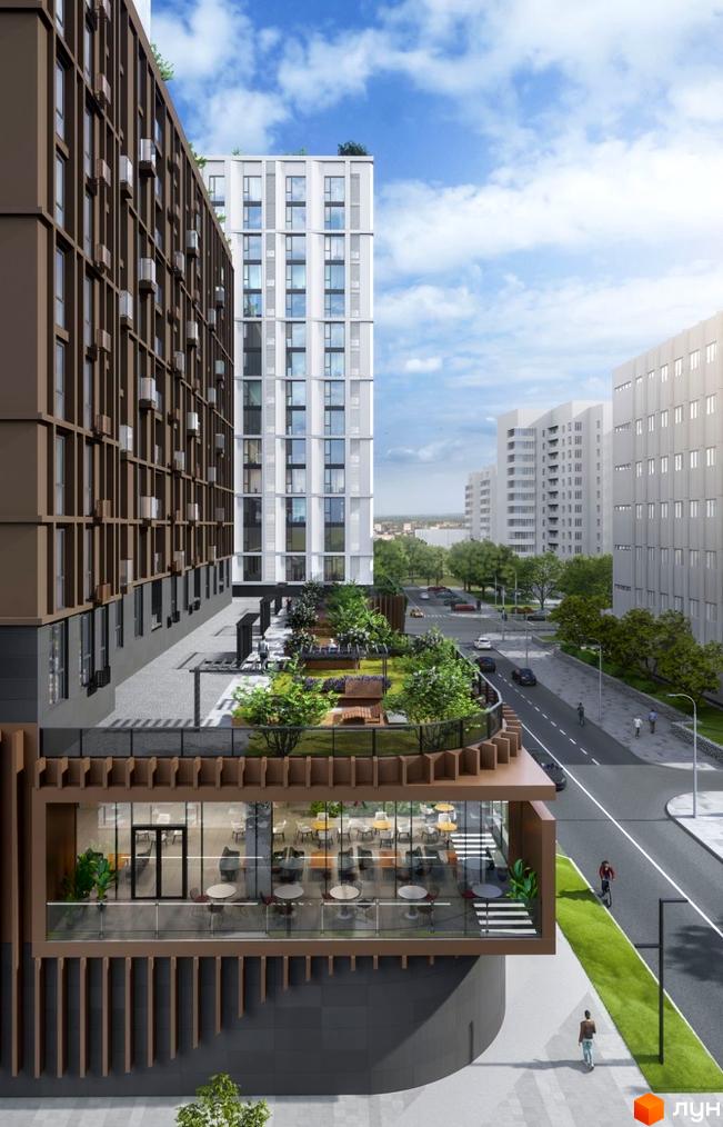 Фасад Апарт-комплексу Capital Tower з коричневими та білими секціями, прибудинкова територія з озелененою терасою та вулицею.