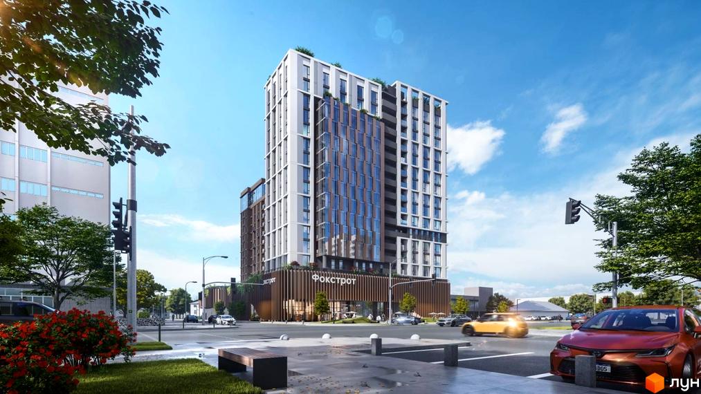 Апарт-комплекс Capital Tower з фасадом з білих та коричневих панелей, розташований на перехресті вулиць з автомобілями та деревами.