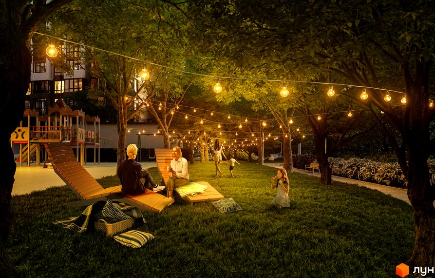 Житловий комплекс 7 KVARTAL: затишна прибудинкова територія з освітленням та місцями для відпочинку.