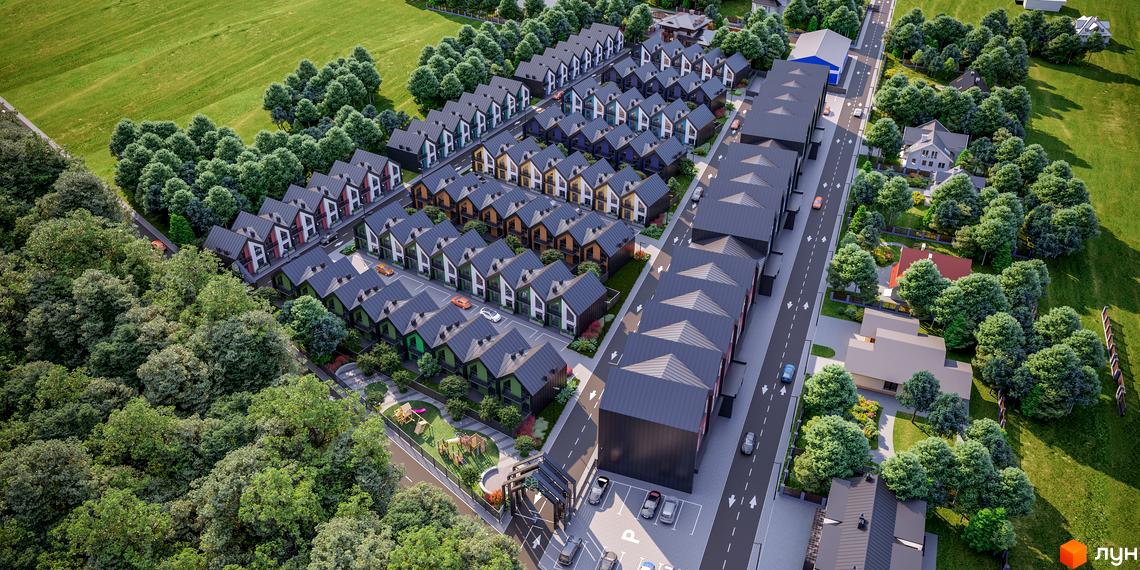 Вид зверху на Таунхауси Freya: ряди будинків з темними дахами та різнокольоровими фасадами, оточені зеленими насадженнями та дитячим майданчиком.