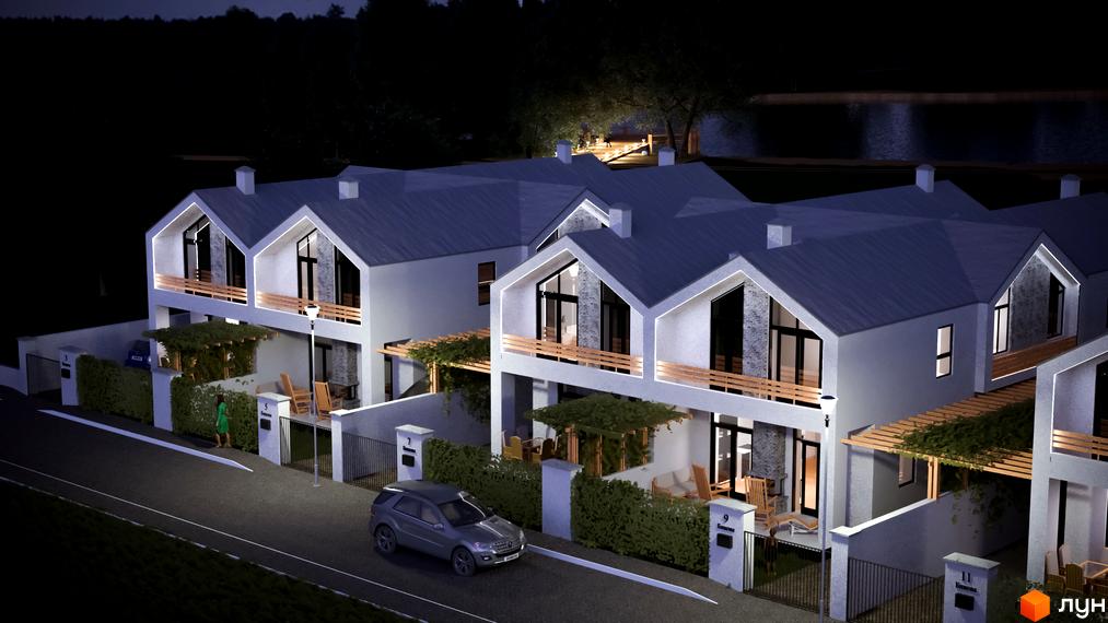 Зовнішній вигляд сучасних таунхаусів на вулиці Бикова вночі. Прибудинкова територія з парканом та освітленням.