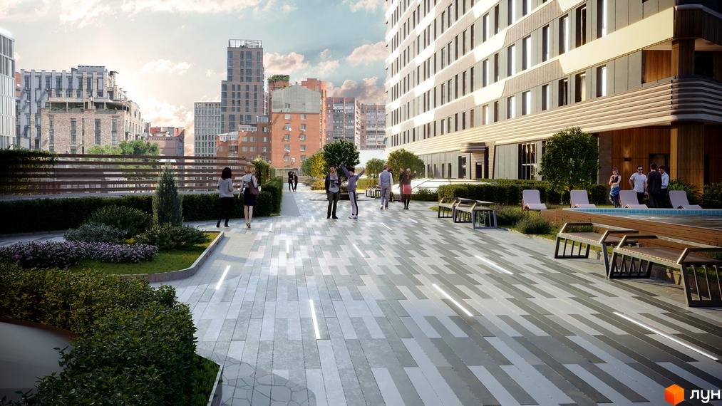 МФК CITÉ: фасади будівель з панорамними вікнами та прибудинкова територія з басейном та зонами відпочинку.