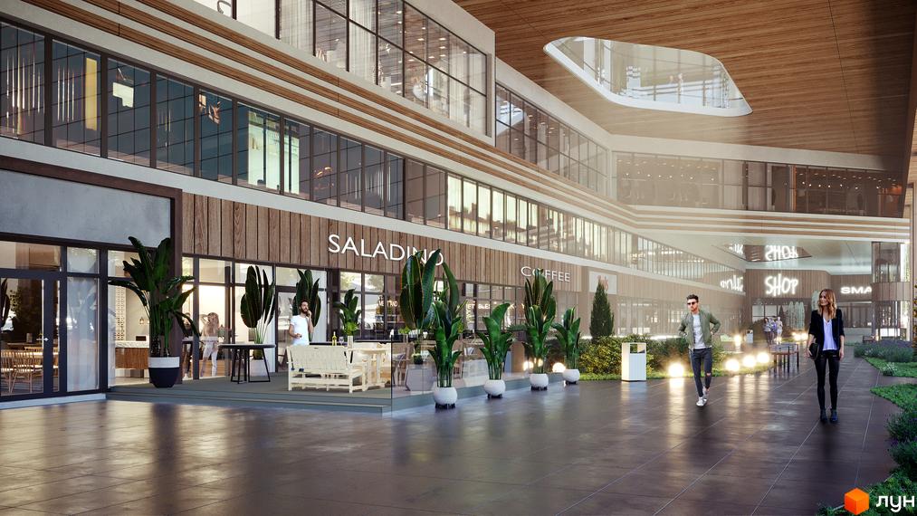 Фасад МФК CITÉ з великими вікнами та дерев'яними елементами, що виходить на простору пішохідну зону з кафе та озелененням.