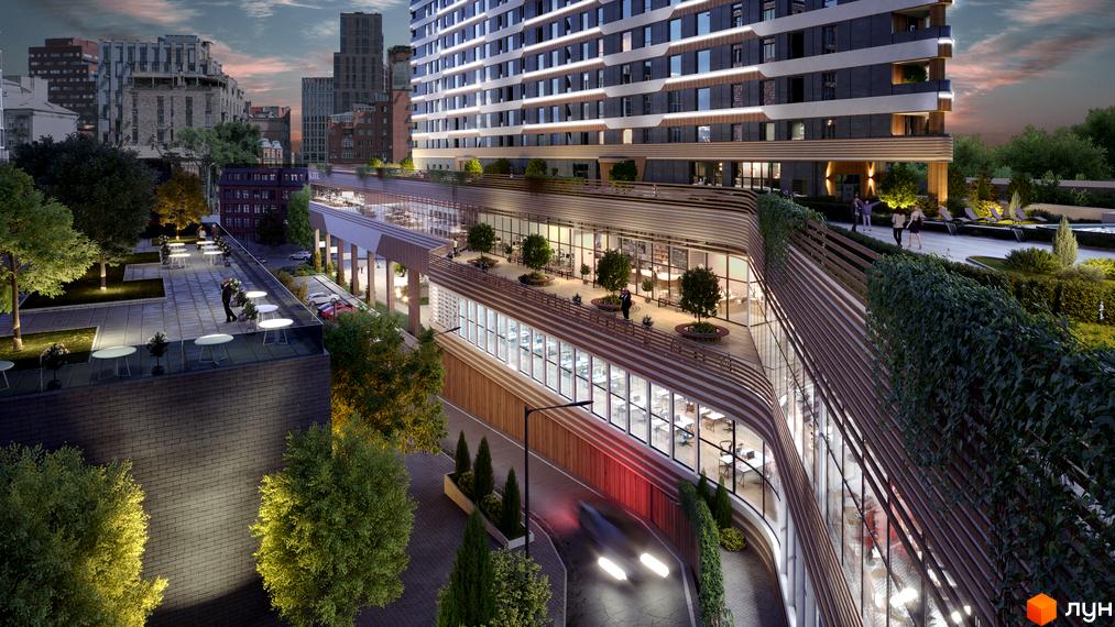 МФК CITÉ: багатоповерховий будинок з вигнутими фасадами та терасами, що виходять на зелену прибудинкову територію з зонами відпочинку.