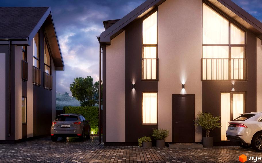 Будинки Котеджного містечка KyivOasis з великими вікнами та освітленням фасаду. На брукованій території припарковані автомобілі.