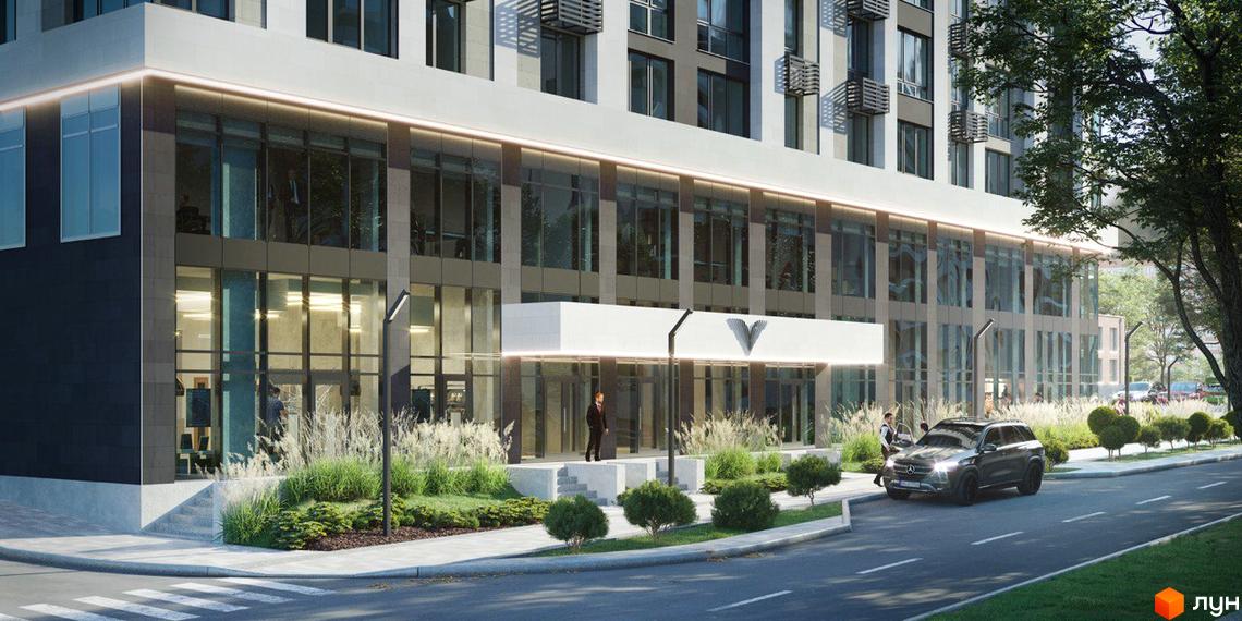 Зовнішній вигляд новобудови ЖК Liberty Gardens з великими вікнами та вхідною групою. Прибудинкова територія з ландшафтним дизайном та дорогою.