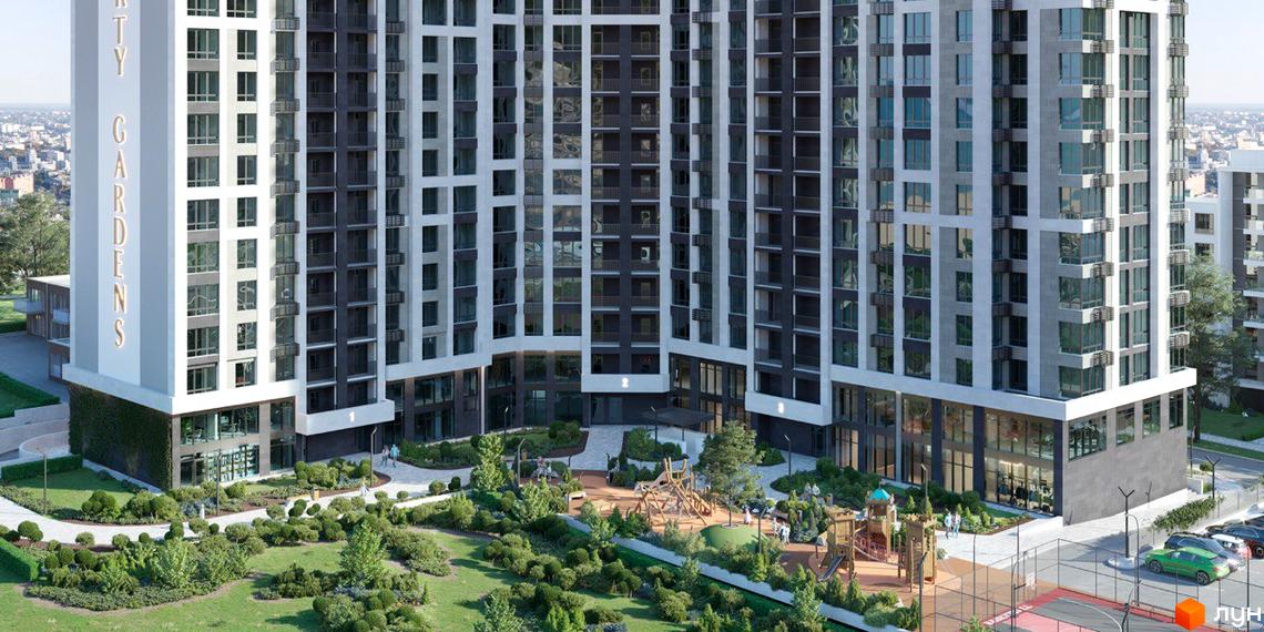 Житловий комплекс Liberty Gardens з фасадами сірого та білого кольору, з численними вікнами та балконами. Прибудинкова територія з дитячим майданчиком та зеленими насадженнями.