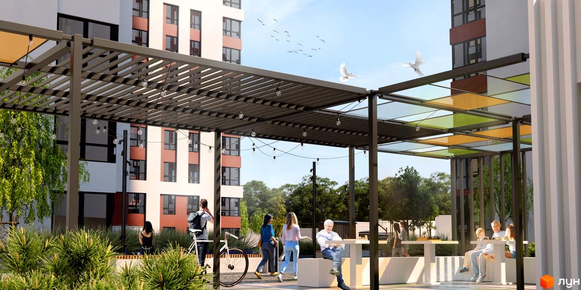 Житловий комплекс Sea View: сучасний фасад будівель та затишна прибудинкова територія з альтанкою та місцями для відпочинку.