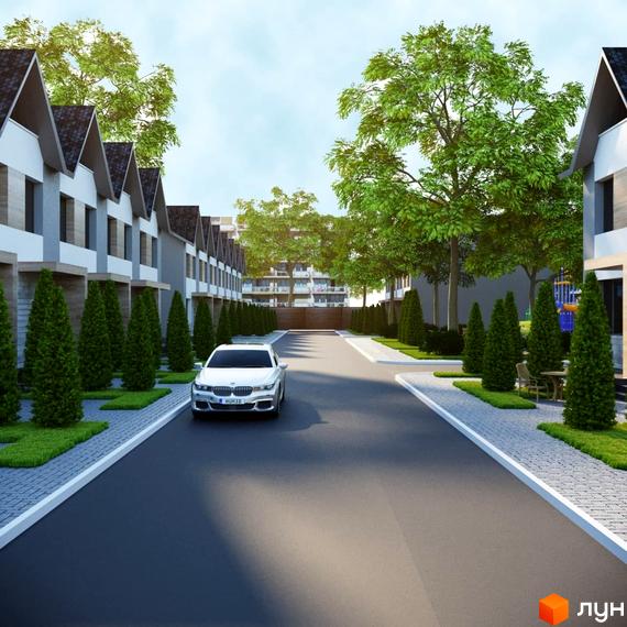Зовнішній вигляд таунхаусів Harmony Avangard з акуратними газонами та дорогою. Комплекс розташований серед дерев.