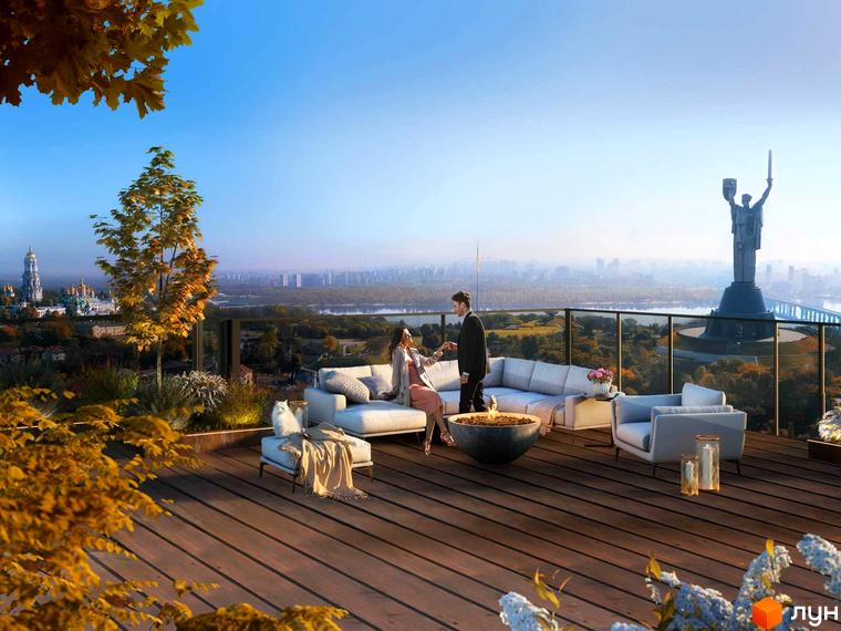 Житловий комплекс EDELDORF HILLS з терасою на даху та видом на місто. На терасі розташовані м'які меблі та зона відпочинку.