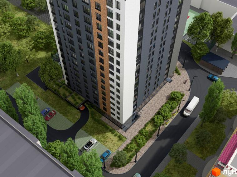 Житловий комплекс ART HOUSE: високий будинок з темно-сірим та білим фасадом. Прибудинкова територія з зеленими насадженнями, парковками та дорогами.