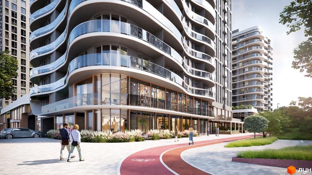 Житловий комплекс Creator City з вигнутими фасадами та скляними балконами. На прибудинковій території облаштована червона доріжка для прогулянок та зелені насадження.