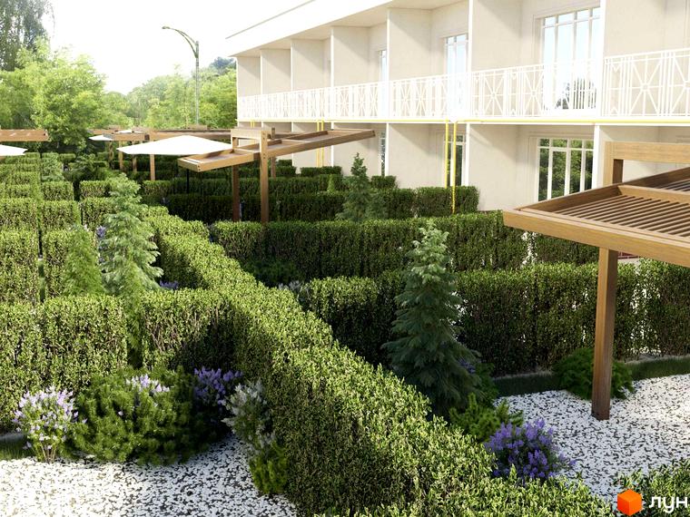 Зовнішній вигляд будівлі житлового комплексу КМ Island з білими балконами та прибудинковою територією з акуратними кущами та деревами.