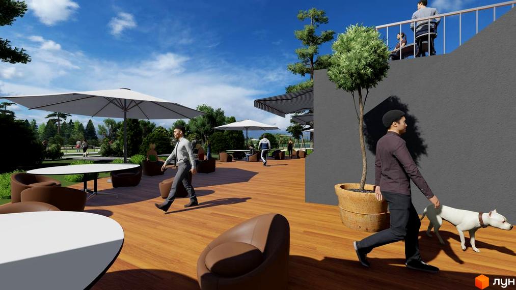 Зовнішній вигляд комплексу КМ BY THE RIVER з терасою для відпочинку та зеленими насадженнями. Прибудинкова територія з місцями для сидіння під парасолями та прогулянковою зоною.