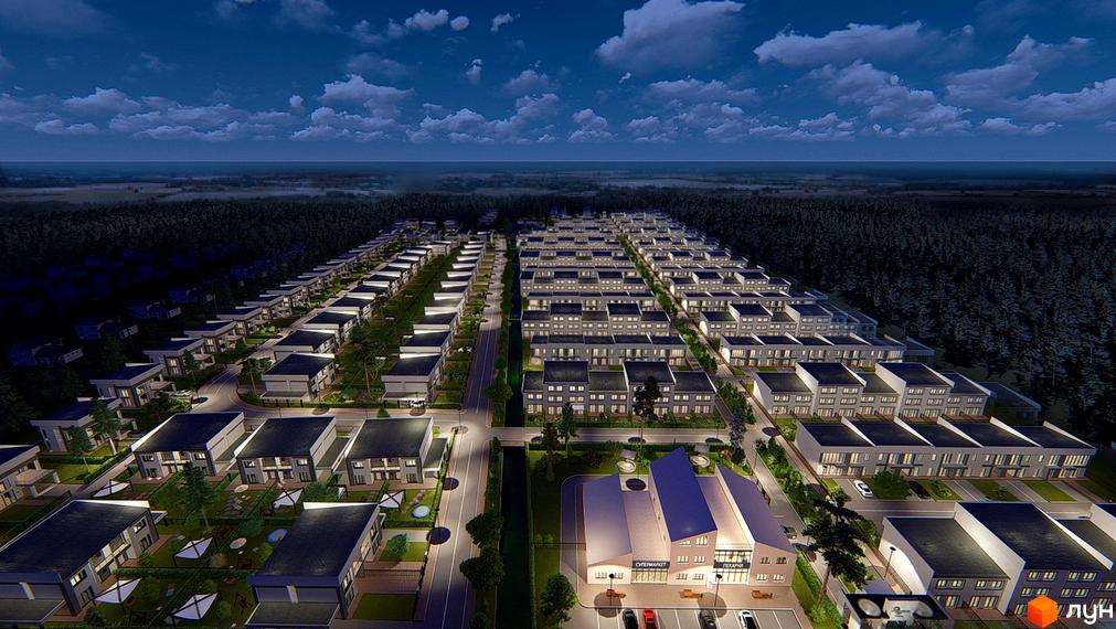 Котеджне містечко Riviera Bucha вночі: ряди двоповерхових будинків з освітленими вікнами. Видно вулиці, зелені зони та комерційний центр.