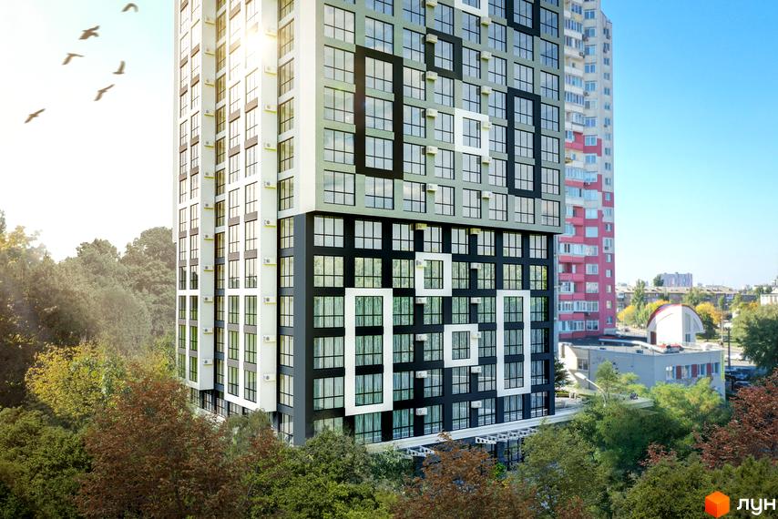 Зовнішній вигляд новобудови ЖК Квітень з панорамними вікнами та кондиціонерами. Навколо будинку зелені дерева та чисте блакитне небо.