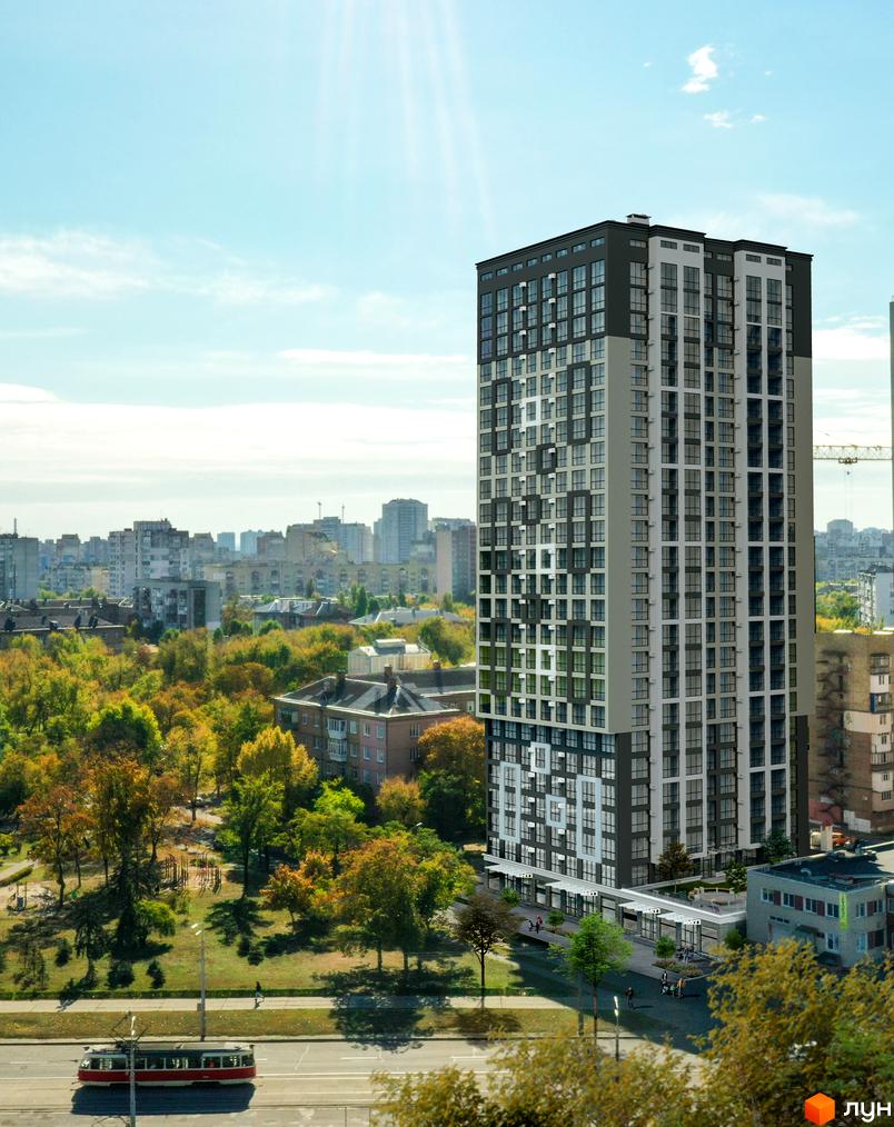 Новобудова ЖК Квітень з сіро-білим фасадом та великою кількістю вікон, розташована біля зеленого парку з деревами та дитячим майданчиком.