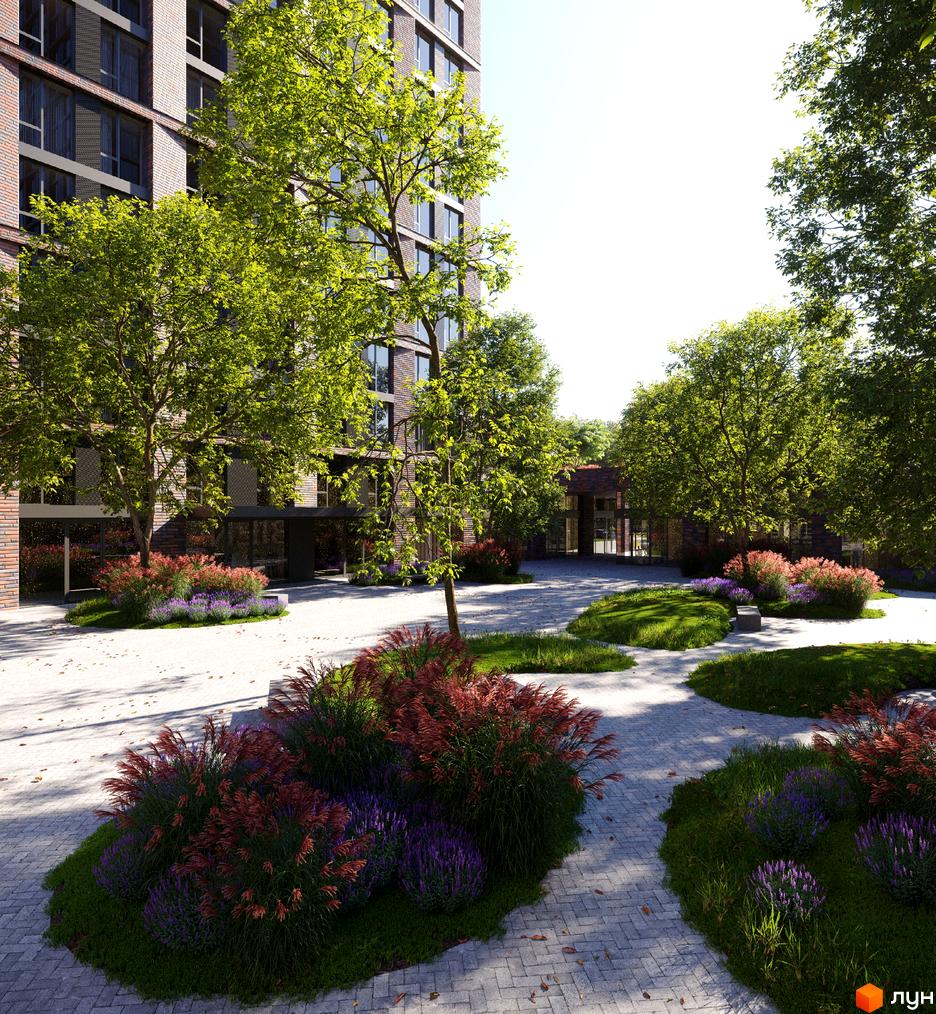 Житловий комплекс MARSHALL з фасадом з червоної цегли. На прибудинковій території зелені газони, дерева та квіти, викладена бруківка.