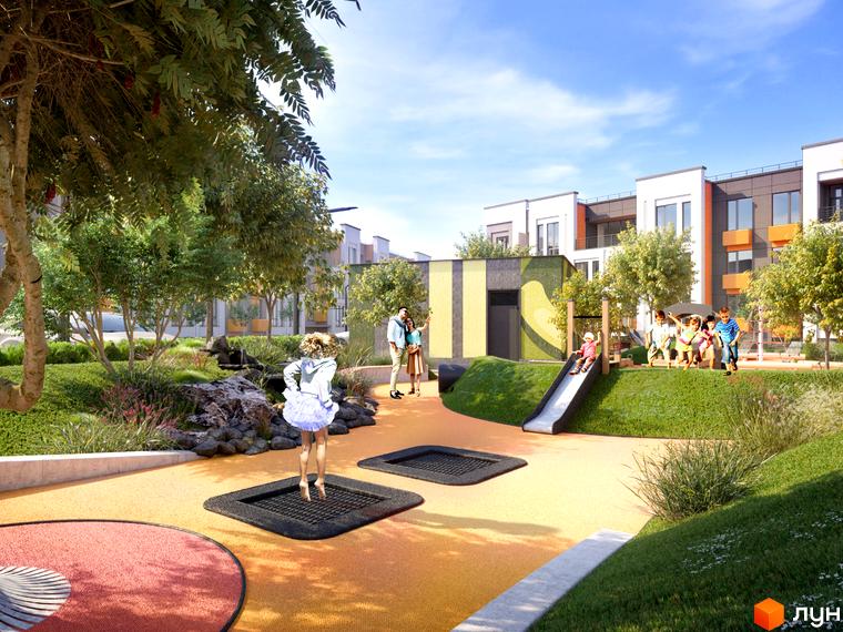 Зображення ігрового майданчика біля будинків Житлового комплексу Найкращий квартал. На території є гірка, батути та багато зелені.