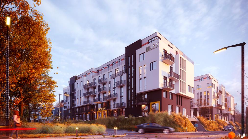 Житловий комплекс SILENT PARK з білими та темними фасадами, балконами з чорними перилами, оточений осінніми деревами та зеленими насадженнями.