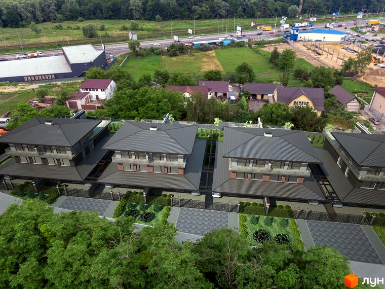 Сучасні дуплекси Posh House з сірими дахами та прибудинковою територією з доглянутими газонами та парканами.